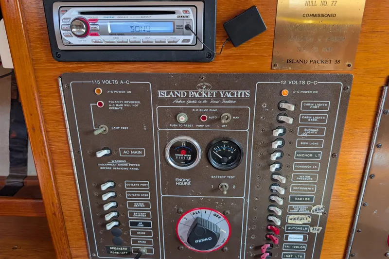 Lone Star Yacht Photos Pics Control panel of a 1988 Island Packet 38 yacht with various switches and gauges.