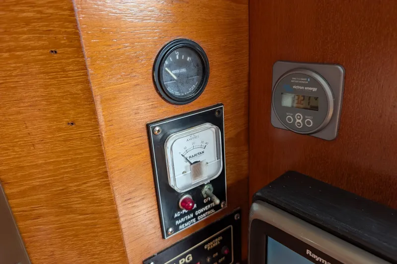 Lone Star Yacht Photos Pics Control panel of 1988 Island Packet 38 sailboat with gauges and meters.