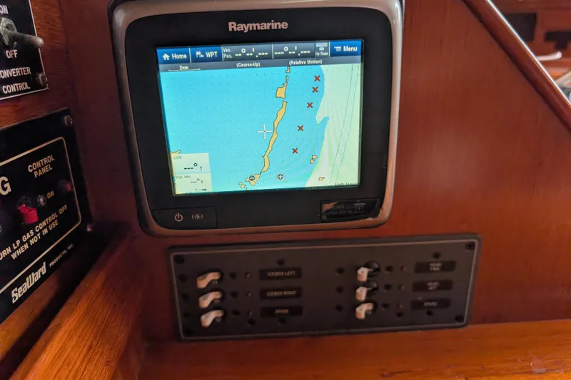 Lone Star Yacht Photos Pics Raymarine navigation system on 1988 Island Packet 38 sailboat, displaying nautical chart.
