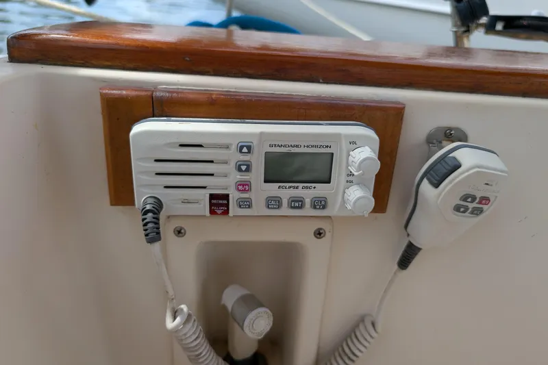Lone Star Yacht Photos Pics VHF radio on 1988 Island Packet 38 sailboat, featuring Standard Horizon Eclipse DSC+ model.