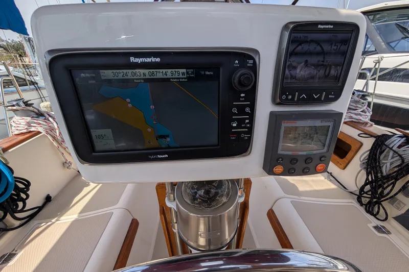 Lone Star Yacht Photos Pics Cockpit navigation system on 1988 Island Packet 38 sailboat, featuring Raymarine displays.
