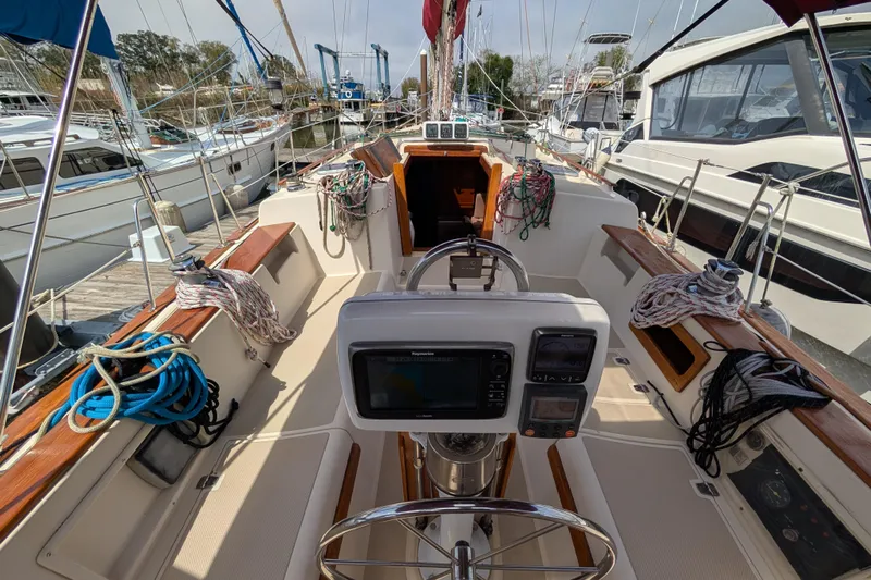 Lone Star Yacht Photos Pics 1988 Island Packet 38 sailboat cockpit with navigation equipment and mooring lines.
