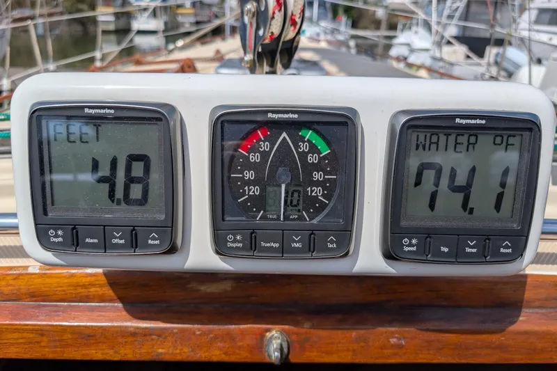 Lone Star Yacht Photos Pics Raymarine instruments on 1988 Island Packet 38 showing depth, wind, and water temperature.