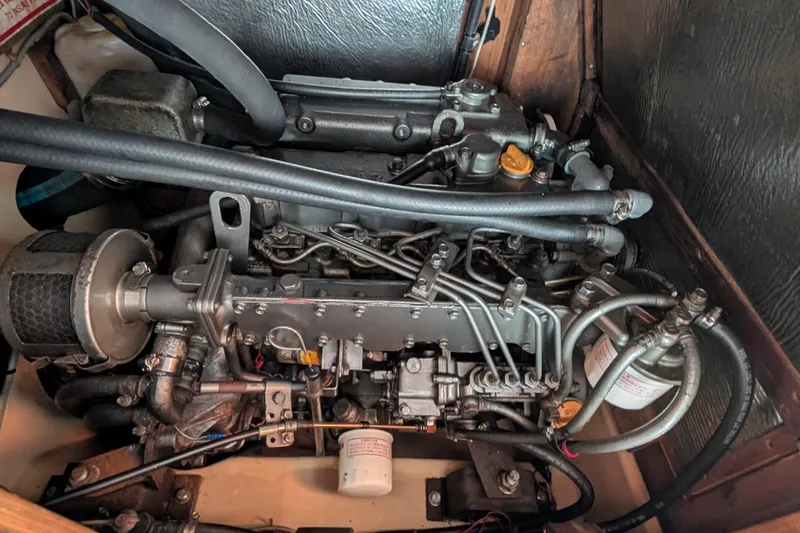 Lone Star Yacht Photos Pics Engine of a 1988 Island Packet 38 sailboat, showcasing detailed mechanical components.