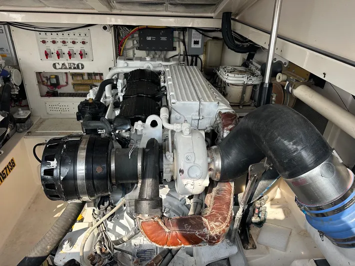  Yacht Photos Pics Engine room of a 2004 Cabo 40 Express boat, showcasing detailed machinery and components.