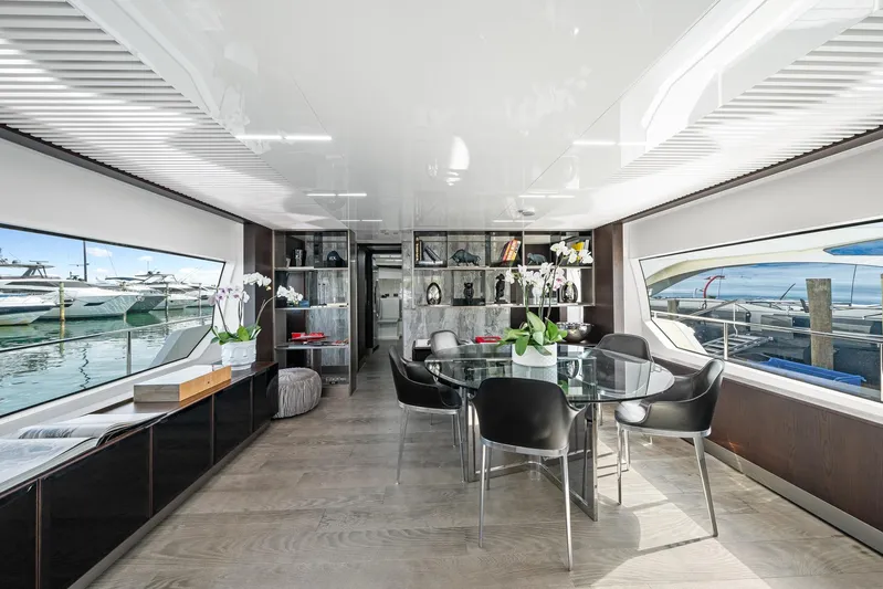 Vix Yacht Photos Pics Luxurious interior of 2018 Ferretti Yachts 850 with elegant dining area and panoramic windows.