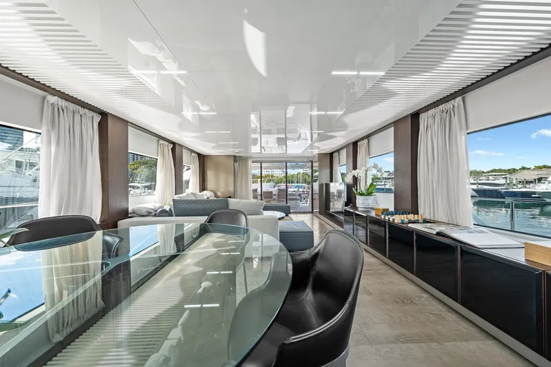 Vix Yacht Photos Pics Luxurious interior of 2018 Ferretti Yachts 850 with elegant dining area and marina view.