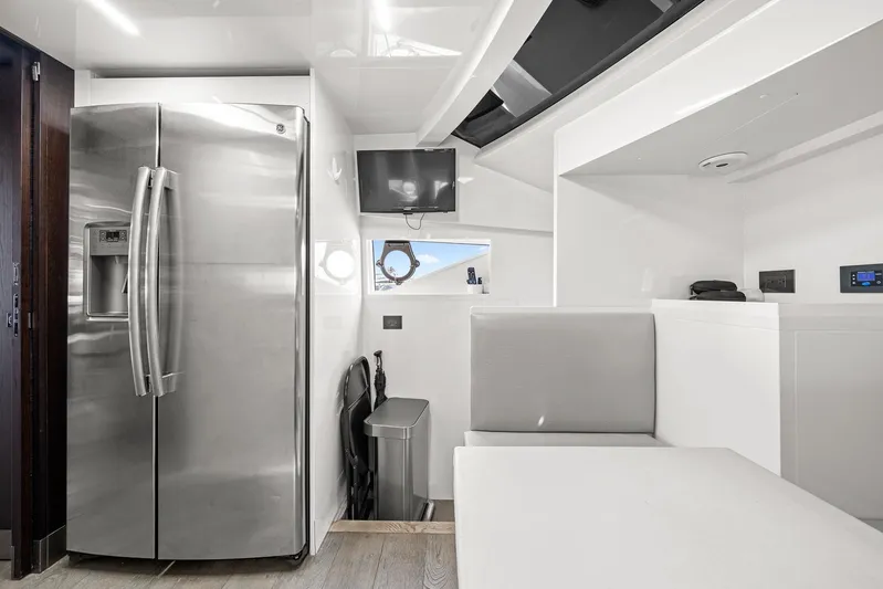 Vix Yacht Photos Pics Modern interior of 2018 Ferretti Yachts 850 with stainless steel fridge and sleek design.