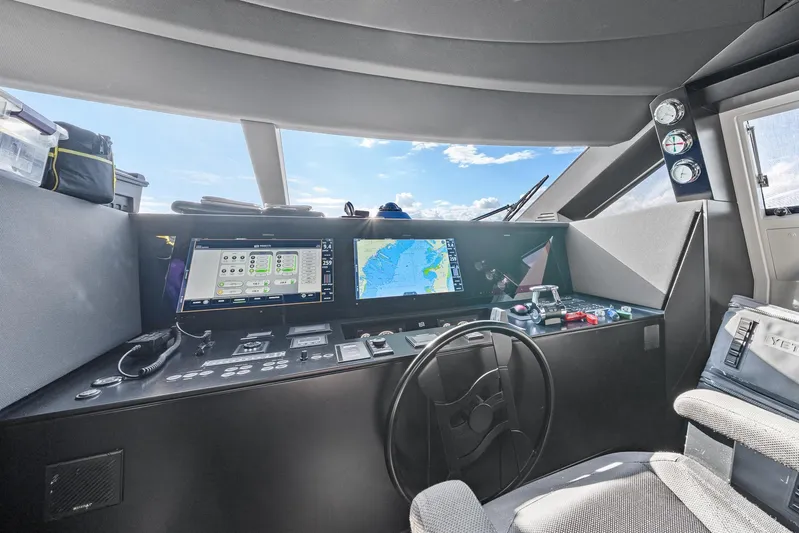 Vix Yacht Photos Pics Cockpit of 2018 Ferretti Yachts 850 with navigation screens and steering wheel.