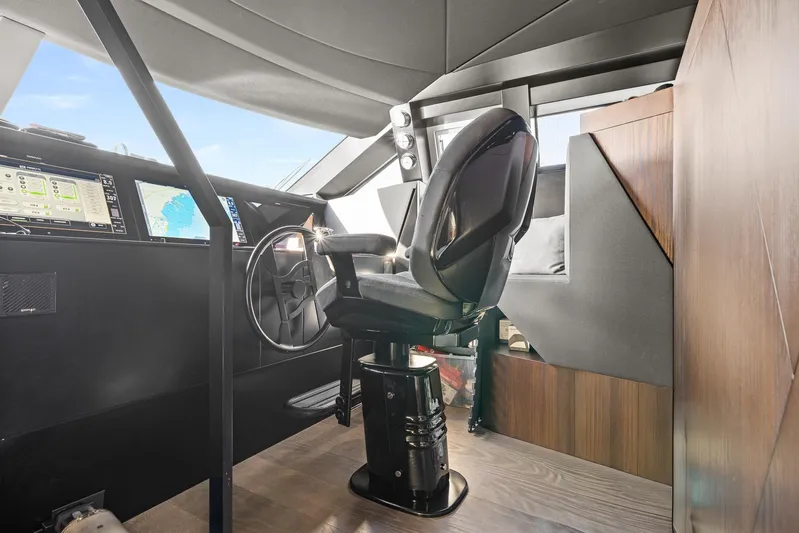 Vix Yacht Photos Pics Cockpit of 2018 Ferretti Yachts 850 with modern navigation equipment and captain's chair.
