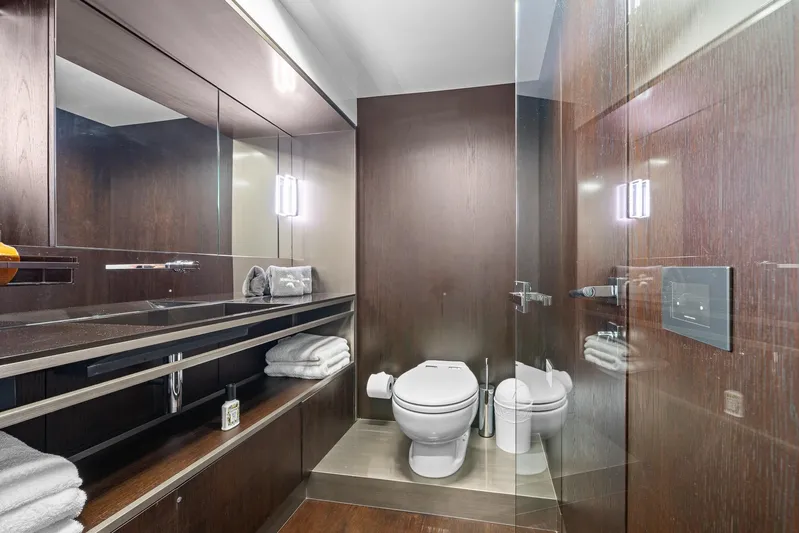 Vix Yacht Photos Pics Luxurious bathroom in 2018 Ferretti Yachts 850, featuring sleek wood finishes and modern fixtures.