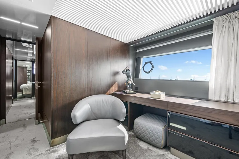 Vix Yacht Photos Pics Luxurious interior of 2018 Ferretti Yachts 850 with elegant seating and desk, featuring a scenic window view.