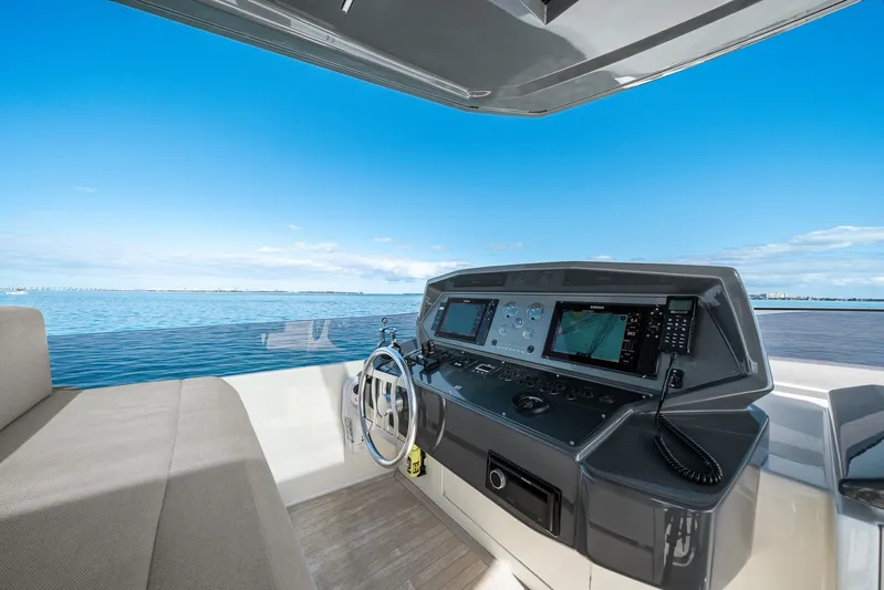 Vix Yacht Photos Pics Helm of 2018 Ferretti Yachts 850 with navigation equipment, overlooking serene ocean view.