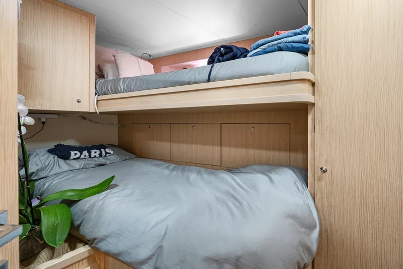 Vix Yacht Photos Pics Bunk beds in 2018 Ferretti Yachts 850 cabin with light wood finish and cozy bedding.