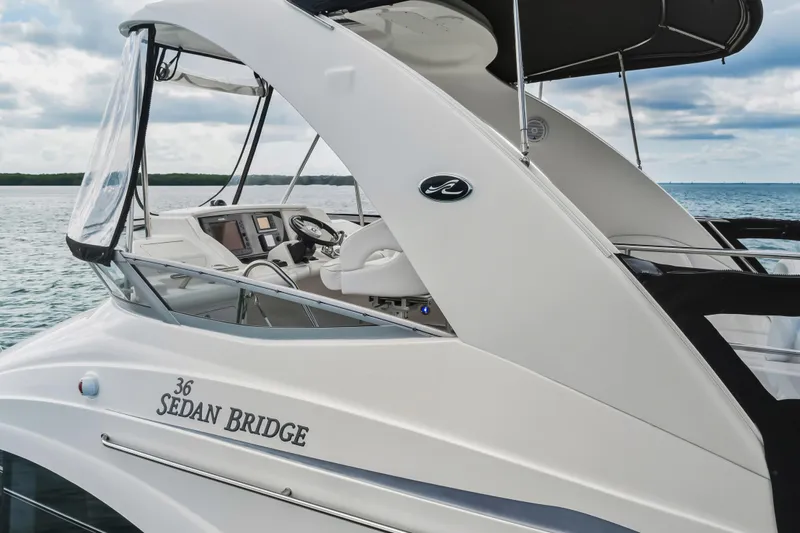 Deep Blue Yacht Photos Pics 2008 Sea Ray 36 Sedan Bridge yacht on calm waters, showcasing sleek design and modern features.