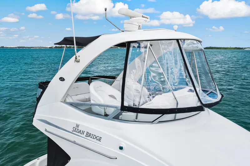 Deep Blue Yacht Photos Pics 2008 Sea Ray 36 Sedan Bridge yacht on clear blue water under a sunny sky.