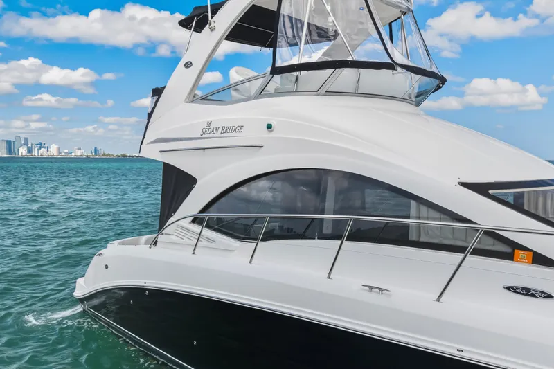 Deep Blue Yacht Photos Pics 2008 Sea Ray 36 Sedan Bridge yacht cruising on blue ocean waters.