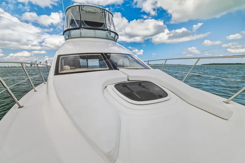 Deep Blue Yacht Photos Pics 2008 Sea Ray 36 Sedan Bridge yacht on open water under blue sky.