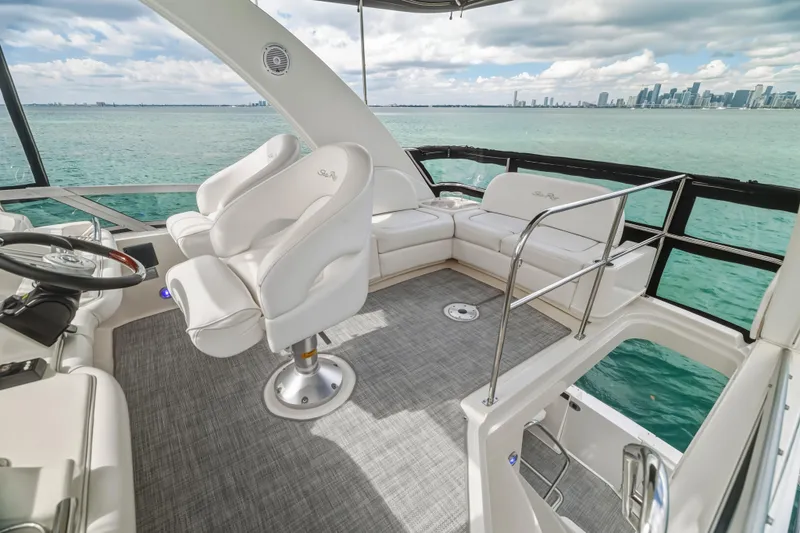 Deep Blue Yacht Photos Pics 2008 Sea Ray 36 Sedan Bridge yacht interior with white seating and ocean view.