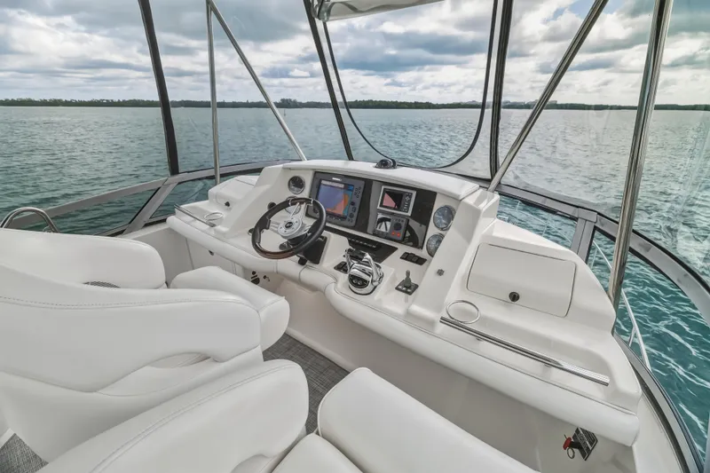 Deep Blue Yacht Photos Pics 2008 Sea Ray 36 Sedan Bridge helm with modern controls and panoramic water view.