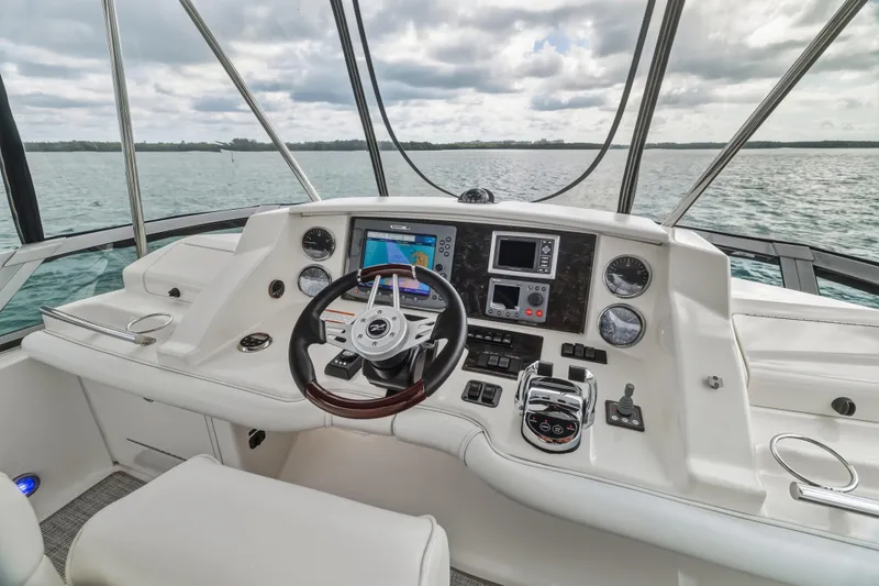 Deep Blue Yacht Photos Pics 2008 Sea Ray 36 Sedan Bridge helm with modern navigation equipment and scenic water view.