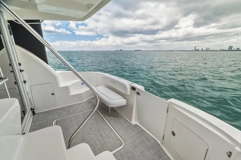 Deep Blue Yacht Photos Pics 2008 Sea Ray 36 Sedan Bridge yacht deck with ocean view and city skyline.