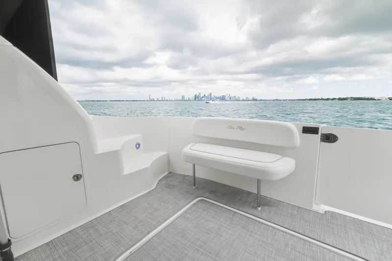 Deep Blue Yacht Photos Pics 2008 Sea Ray 36 Sedan Bridge boat deck with city skyline view.