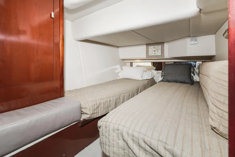 Deep Blue Yacht Photos Pics 2008 Sea Ray 36 Sedan Bridge cabin with twin beds and wooden cabinetry.