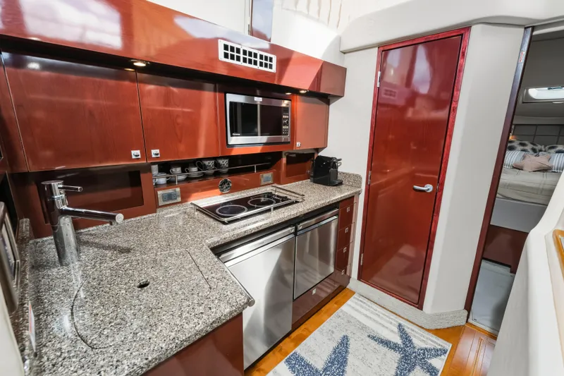 Deep Blue Yacht Photos Pics 2008 Sea Ray 36 Sedan Bridge yacht kitchen with granite countertops and modern appliances.