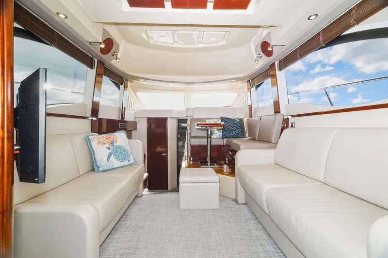 Deep Blue Yacht Photos Pics Luxurious interior of 2008 Sea Ray 36 Sedan Bridge yacht with plush seating and modern decor.