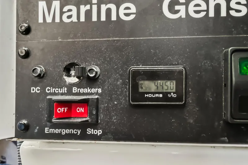 Deep Blue Yacht Photos Pics Marine generator control panel with circuit breakers and hour meter reading 4450 hours. Sea Ray 36 Sedan Bridge 2008.