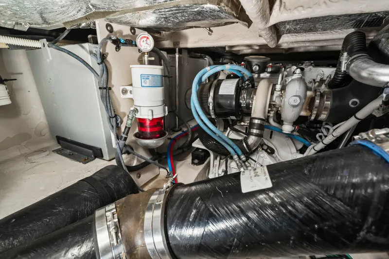 Deep Blue Yacht Photos Pics Engine room of 2008 Sea Ray 36 Sedan Bridge, showcasing mechanical components and wiring.