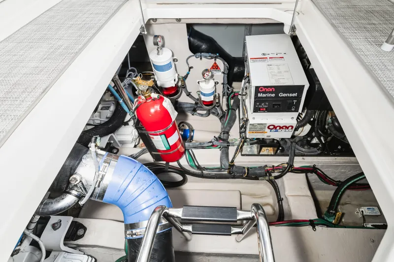 Deep Blue Yacht Photos Pics Engine compartment of 2008 Sea Ray 36 Sedan Bridge with Onan Marine Genset and fire extinguisher.