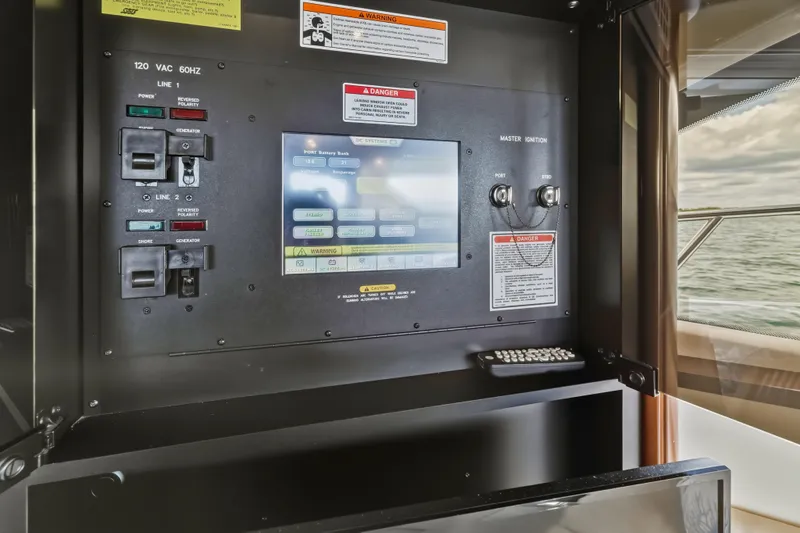 Deep Blue Yacht Photos Pics Control panel of 2008 Sea Ray 36 Sedan Bridge yacht with switches and display.