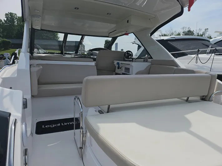  Yacht Photos Pics 2011 Regal 42 Sport Coupe interior with beige seating and modern design.