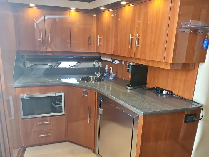  Yacht Photos Pics Luxurious kitchen in 2011 Regal 42 Sport Coupe yacht with modern appliances.