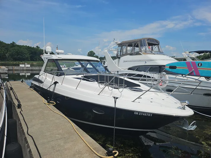  Yacht Photos Pics 2011 Regal 42 Sport Coupe docked at marina under clear blue sky.