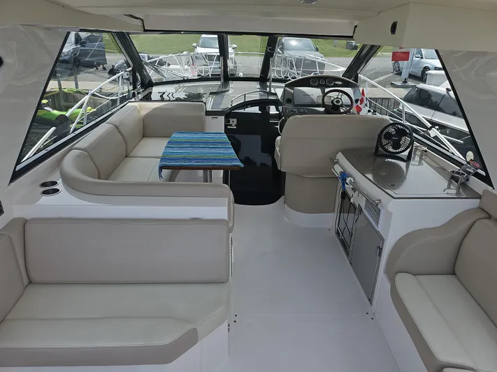  Yacht Photos Pics Interior of 2011 Regal 42 Sport Coupe yacht with seating and helm.