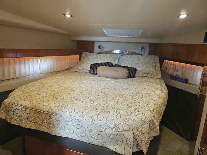  Yacht Photos Pics Luxurious bedroom interior of 2011 Regal 42 Sport Coupe yacht with elegant bedding.