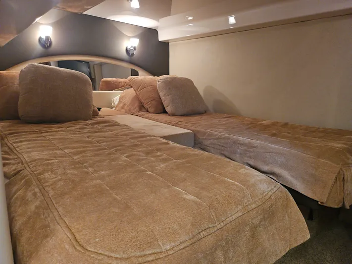  Yacht Photos Pics Interior cabin of 2011 Regal 42 Sport Coupe with twin beds and cozy lighting.