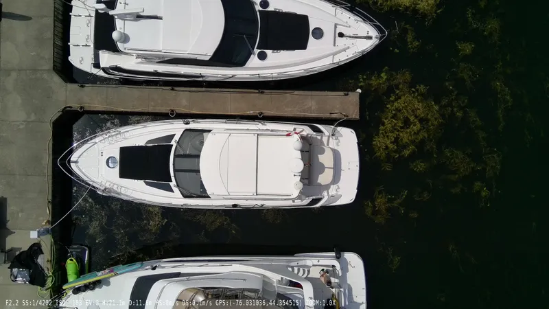  Yacht Photos Pics Overhead view of a 2011 Regal 42 Sport Coupe docked at a marina.