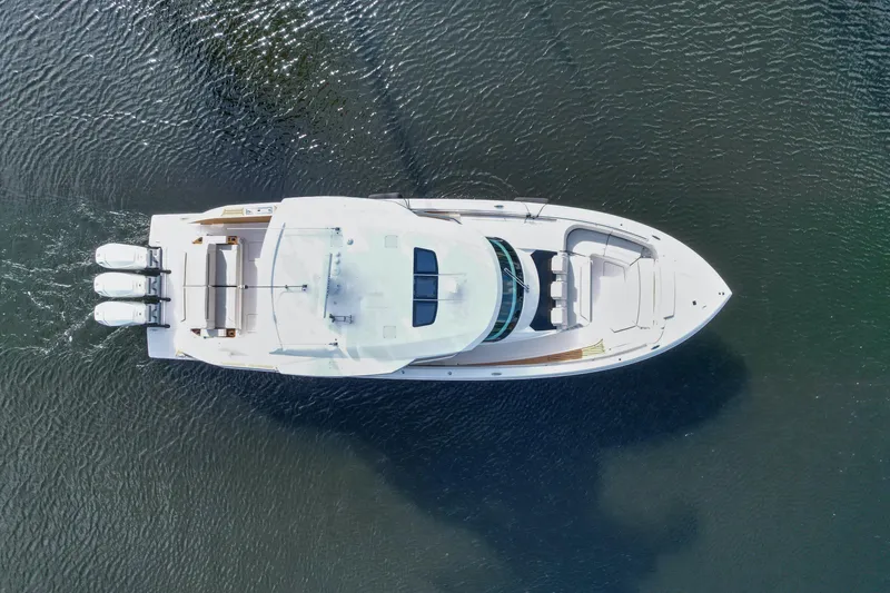  Yacht Photos Pics Aerial view of 2022 Tiara Yachts 48 LS cruising on water.