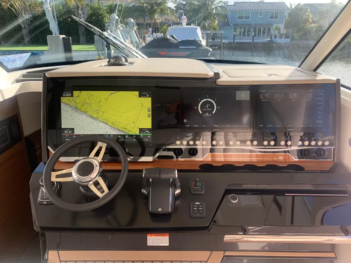  Yacht Photos Pics 2022 Tiara Yachts 48 LS helm with advanced navigation and control systems.