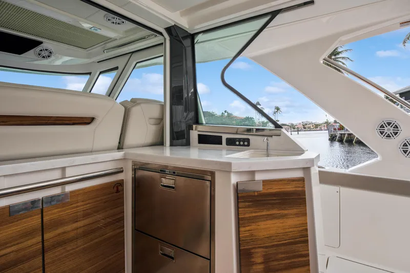  Yacht Photos Pics 2022 Tiara Yachts 48 LS interior with modern kitchen and waterfront view.