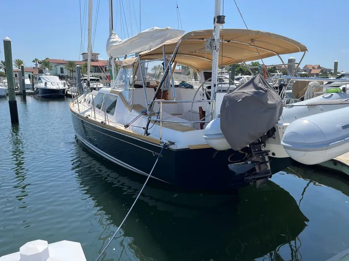 Sapphire Yacht Photos Pics 2014 Tartan 4700 sailboat docked in a marina.