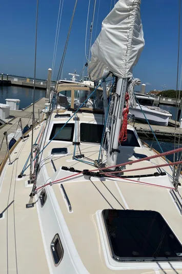 Sapphire Yacht Photos Pics 2014 Tartan 4700 sailboat docked at a marina.