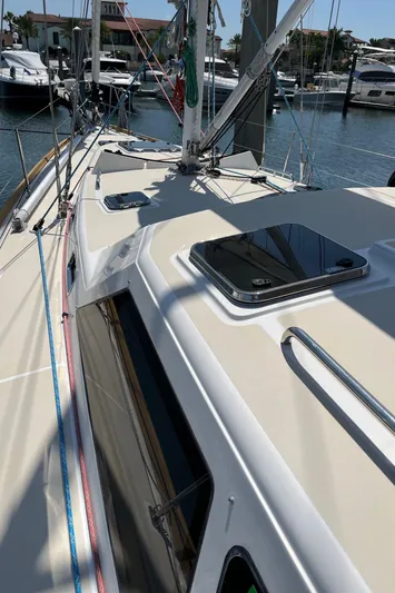 Sapphire Yacht Photos Pics 2014 Tartan 4700 sailboat docked at a marina, showing deck and rigging.