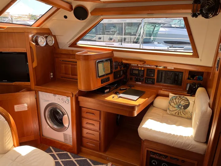 Sapphire Yacht Photos Pics Interior of 2014 Tartan 4700 sailboat with navigation station and washer.