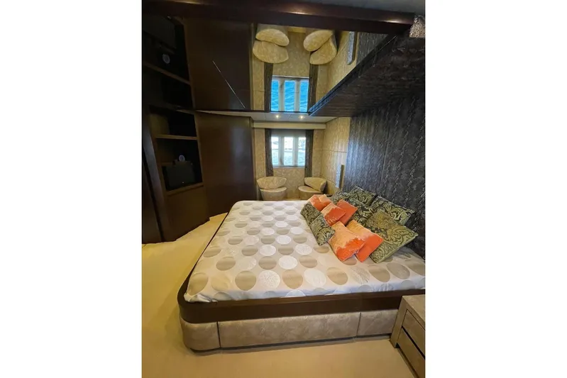 Andea Yacht Photos Pics Luxurious bedroom interior on 2008 Tecnomar Nadara 26 Fly yacht, featuring elegant decor and plush bedding.