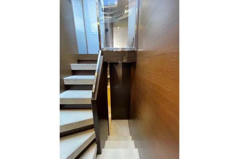 Andea Yacht Photos Pics Staircase inside 2008 Tecnomar Nadara 26 Fly yacht, featuring modern design and wood paneling.